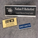 Plastic Name Badges & Signs available in a variety of colors & sizes with or without a logo.Backing options: Pin, magnet, clip & double clutch, Tape, Velcro or holes cut.License Plate Holders Available in Black or Silver frame. Plastic inserts available in a variety of colors.Name Plates.